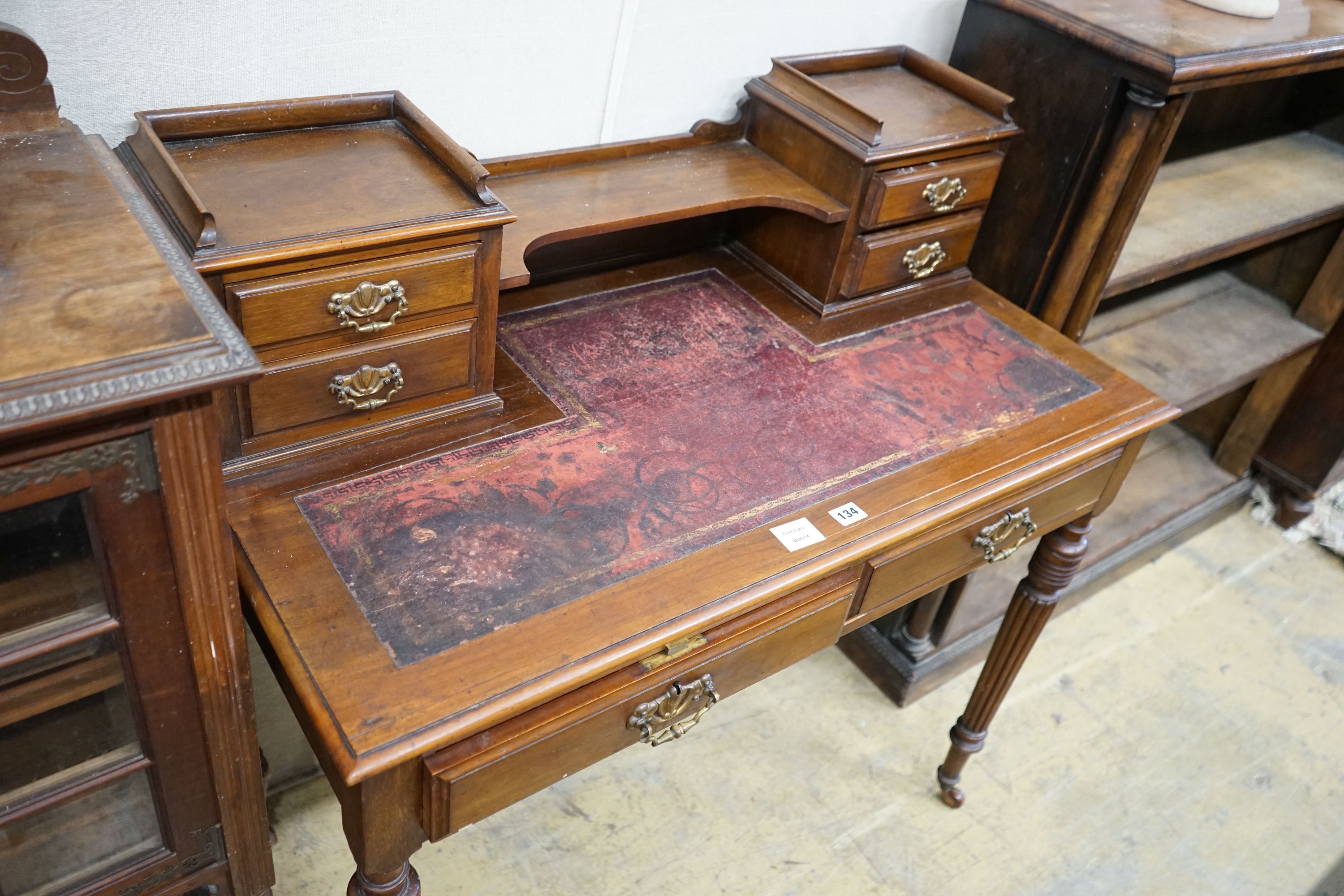 A late Victorian mahogany writing table, width 99cm, depth 52cm, height 100cm